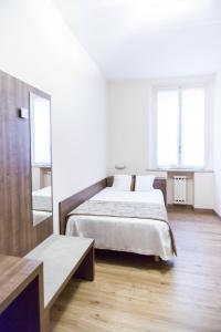 Łóżko lub łóżka w pokoju w obiekcie Best Western Hotel Libertà