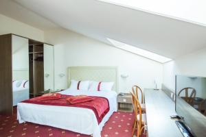 Łóżko lub łóżka w pokoju w obiekcie Best Western Hotel Libertà
