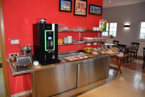 a restaurant kitchen with a counter with food on it at PS Orion in Wenduine
