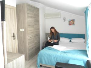 Postel nebo postele na pokoji v ubytování Sava Hotel