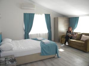 Postel nebo postele na pokoji v ubytování Sava Hotel