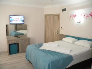 Postel nebo postele na pokoji v ubytování Sava Hotel