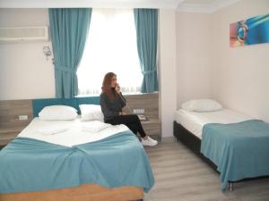 Postel nebo postele na pokoji v ubytování Sava Hotel