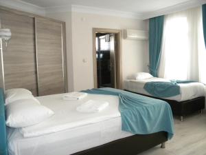 Postel nebo postele na pokoji v ubytování Sava Hotel