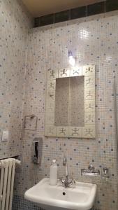 a bathroom with a sink and a mirror at Hospitality Centrum- River in Bucharest +40 photos