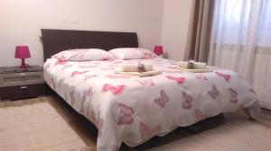 Postel nebo postele na pokoji v ubytování Apartments Mari