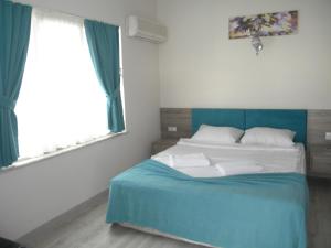Postel nebo postele na pokoji v ubytování Sava Hotel