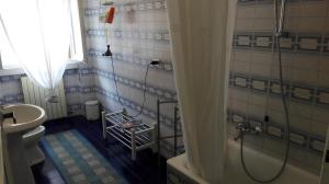 a bathroom with a shower and a toilet and a sink at Bed and Breakfast Campel Inzago in Inzago