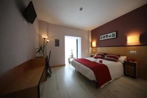 Postel nebo postele na pokoji v ubytování Hotel Alda Entrearcos