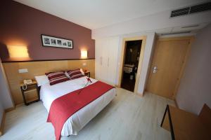 Postel nebo postele na pokoji v ubytování Hotel Alda Entrearcos
