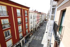 a view of a city street with buildings at Hotel Alda Entrearcos in Burgos