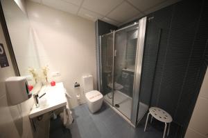Koupelna v ubytování Hotel Alda Entrearcos