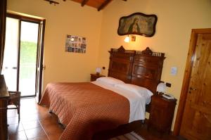 a bedroom with a bed in a room at Albergotto Natalina in Grazzano Badoglio