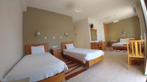 Voodi või voodid majutusasutuse Hotel Lykeon toas