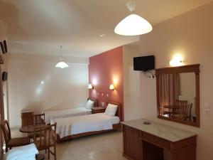 Voodi või voodid majutusasutuse Hotel Lykeon toas