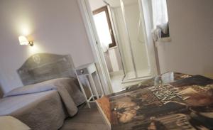 Posteľ alebo postele v izbe v ubytovaní B&B Il Senesino