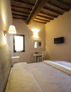 Posteľ alebo postele v izbe v ubytovaní B&B Il Senesino