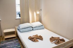 Een bed of bedden in een kamer bij Hostel Oras