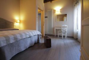 Posteľ alebo postele v izbe v ubytovaní B&B Il Senesino