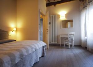 Posteľ alebo postele v izbe v ubytovaní B&B Il Senesino