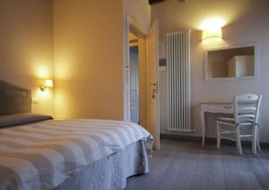 Posteľ alebo postele v izbe v ubytovaní B&B Il Senesino