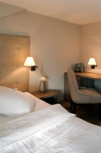 Letto o letti in una camera di Bad Bubendorf Design & Lifestyle Hotel