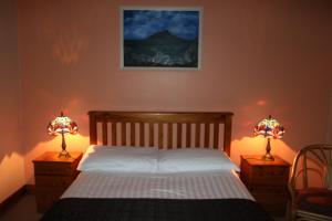 Ένα ή περισσότερα κρεβάτια σε δωμάτιο στο An Portán Guest House