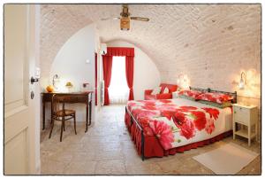 Un pat sau paturi într-o cameră la Santo Stefano