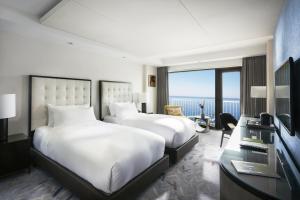 Postel nebo postele na pokoji v ubytování Paradise Hotel Busan