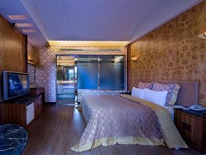 Postel nebo postele na pokoji v ubytování Lai Yin Motel