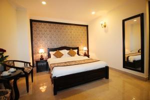 Letto o letti in una camera di Royal Dalat Hotel