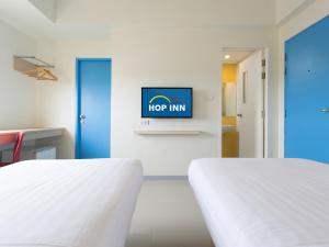Postel nebo postele na pokoji v ubytování HOP INN Rayong