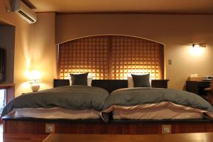 Letto o letti in una camera di Hanaichi