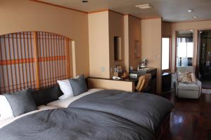 Letto o letti in una camera di Hanaichi