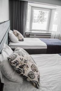 Krevet ili kreveti u jedinici u objektu Hotel Paljakka
