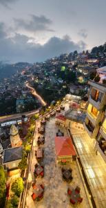 an overhead view of a city with buildings and umbrellas at Hotel Combermere in Shimla