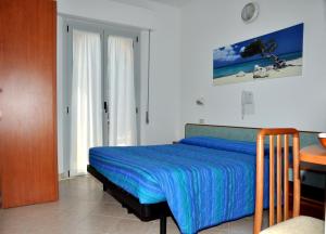 Postel nebo postele na pokoji v ubytování Hotel Holiday Beach
