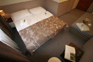 Postel nebo postele na pokoji v ubytování Anette Hotel