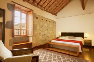 Een bed of bedden in een kamer bij Hotel Rural El Mondalón