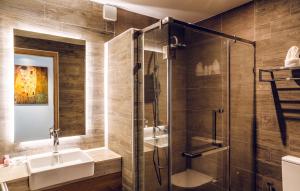 a bathroom with a sink and a shower at 15 Palms Beach Resort in Ko Chang