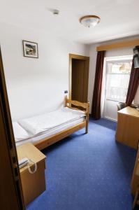 Postel nebo postele na pokoji v ubytování Hotel El Geiger