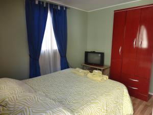 Postel nebo postele na pokoji v ubytování Hostal Residencia Blest Gana