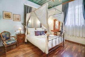 Кровать или кровати в номере Casa Leone Hotel
