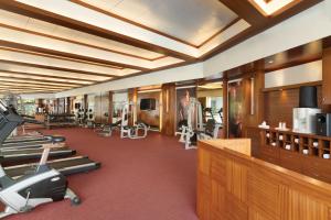 a gym with treadmills and exercise equipment in it at Ramada by Wyndham Navi Mumbai in Navi Mumbai