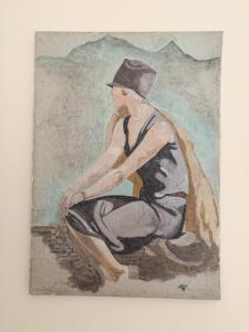 a painting of a man wearing a hat at Venticello Apartment in Bari