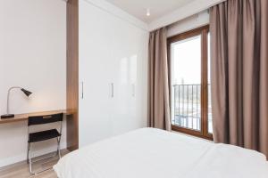 Posteľ alebo postele v izbe v ubytovaní Platinum Residence Mokotów
