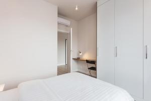 Posteľ alebo postele v izbe v ubytovaní Platinum Residence Mokotów