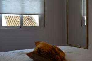 Łóżko lub łóżka w pokoju w obiekcie Apartamento Ancla 26