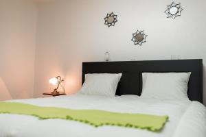 Ένα ή περισσότερα κρεβάτια σε δωμάτιο στο Recanto dos Sonhos