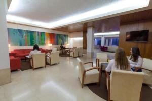 a group of people sitting in a waiting room at Hotel Eurosol Leiria & Jardim in Leiria